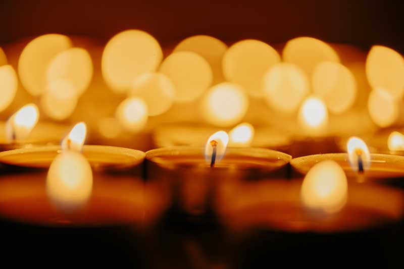 bereavement catering in quincy ma - photo of lit memorial candles
