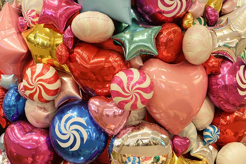 we're one of the best choices for holiday party restaurants in quincy ma! This is a photo of some fanciful Christmas balloons shaped like candy, stars, and hearts.