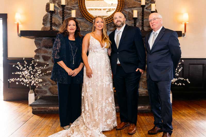 a small wedding venue in quincy ma - here's a photo of a past wedding couple and their parents at the fox & hound